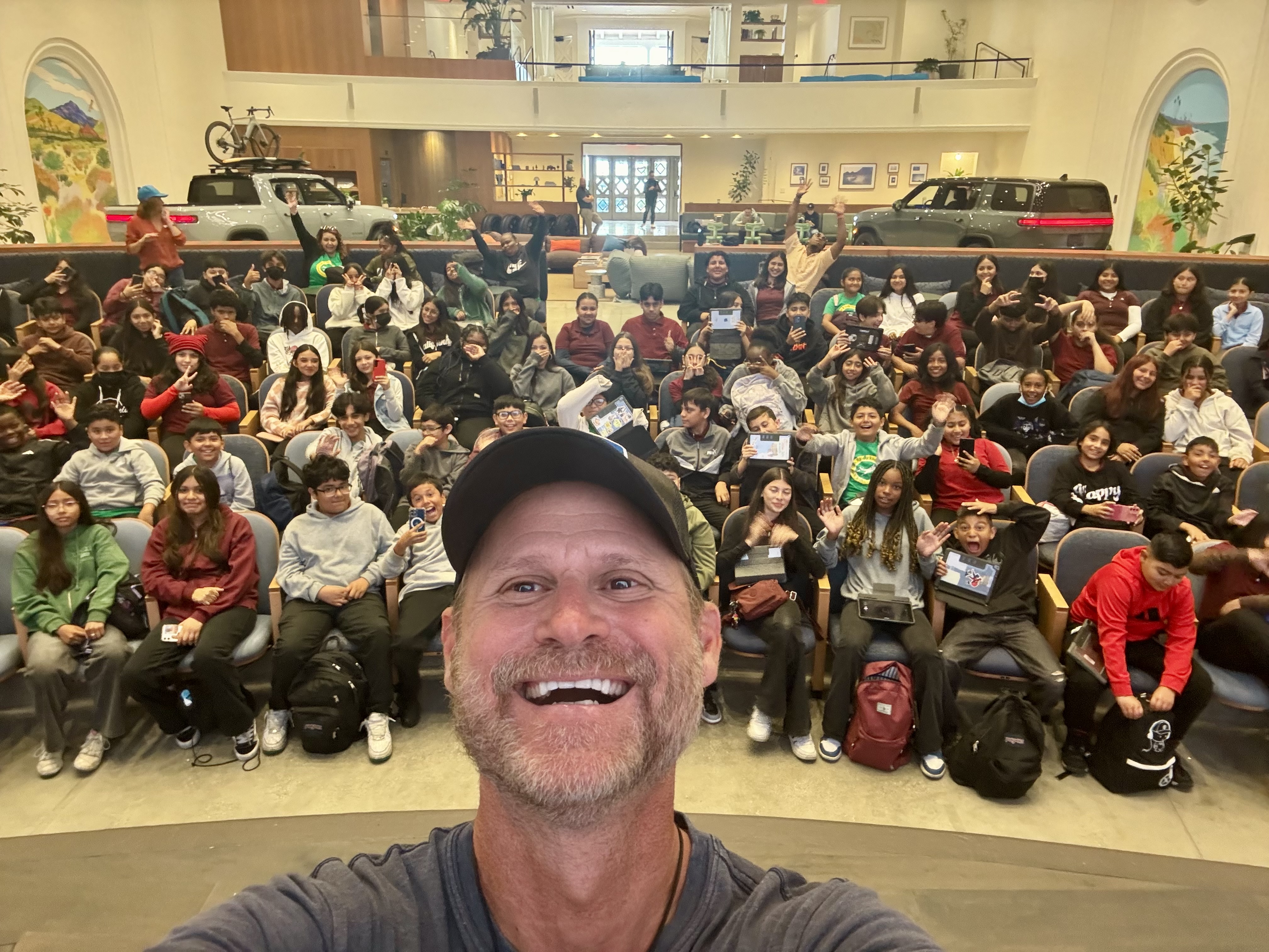 Rich German with large group of students in auditorium, educational impact, inspiring youth engagement with ocean conservation